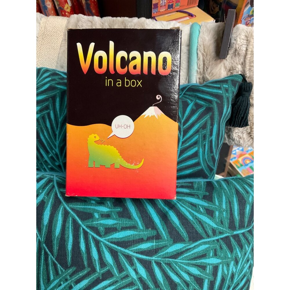 "Volcano In A Box" Science Kit For Kids Box is worn
